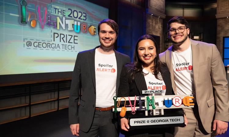 The three creators of SpoilerALERT with the 2nd Place trophy after the 2023 InVenture Prize finals. Pictured are biomedical engineering students Mark Nissen, Sierra Houang, and Grady Lee.