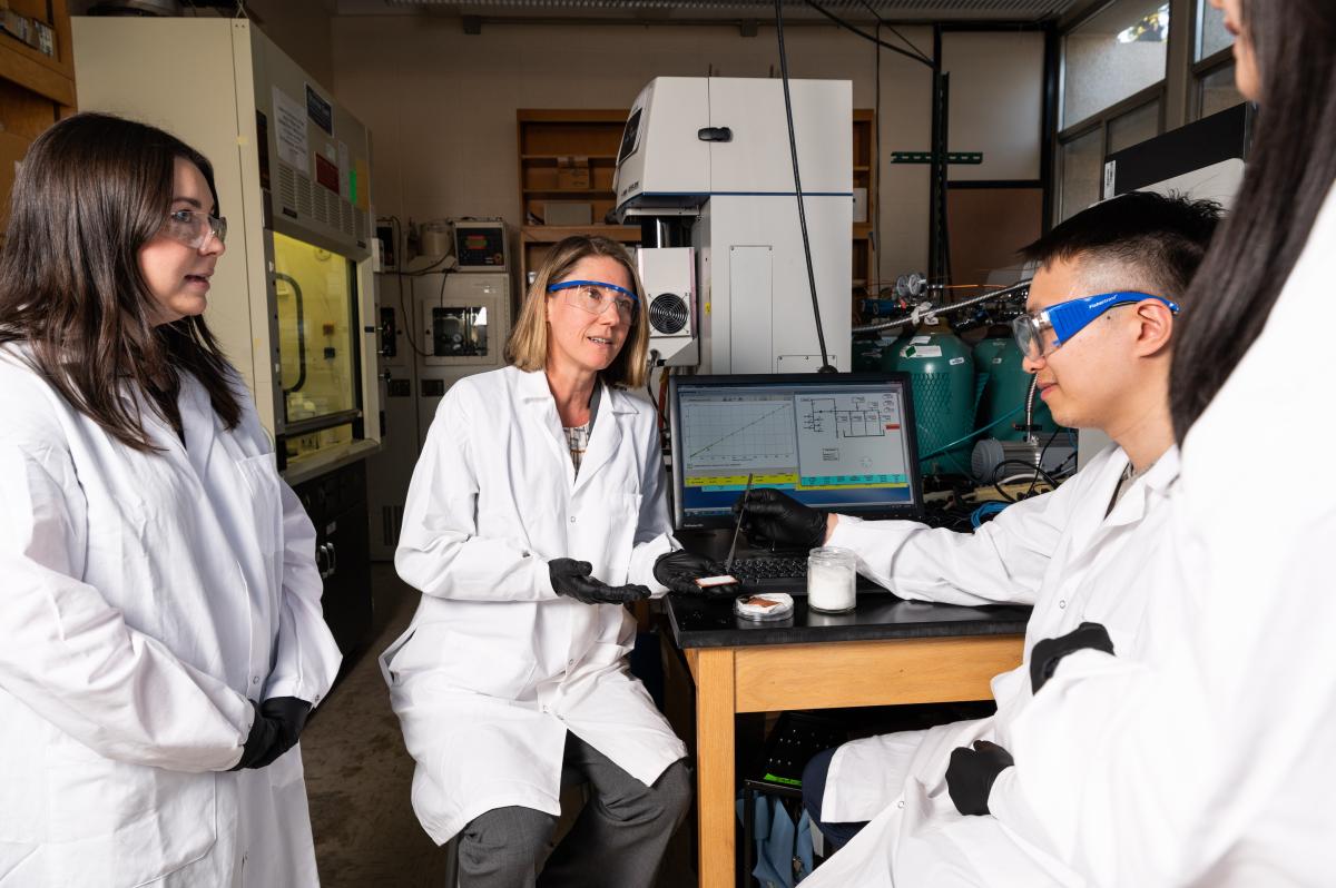 Krista Walton works in the lab with students