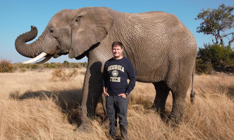 Andrew Schulz with an elephant