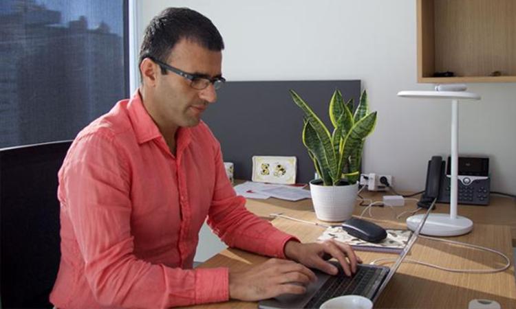 Saman Zonouz works on a computer