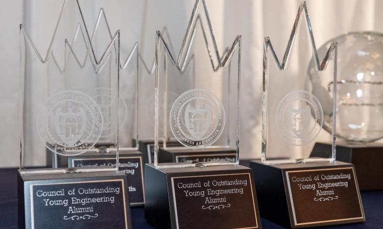 The Awards for the Council of Outstanding Young Engineering Alumni on a table
