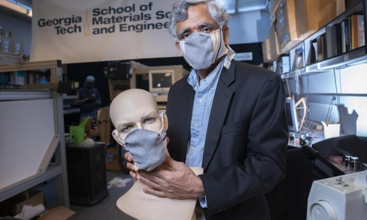 Sundaresan Jayaraman demonstrates a redesigned face mask prototype in the lab